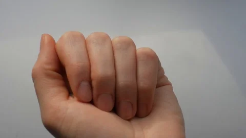 Hand appears in the frame. Hand opens, showing pills in his palm. The hand close Video stock 124825745