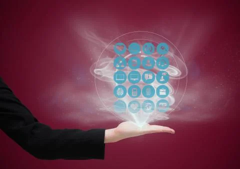Hand with application icons coming up from it. dark red background Foto stock
