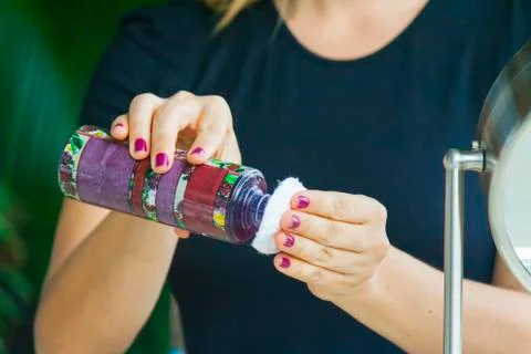 Hand applying cream Stock Photos