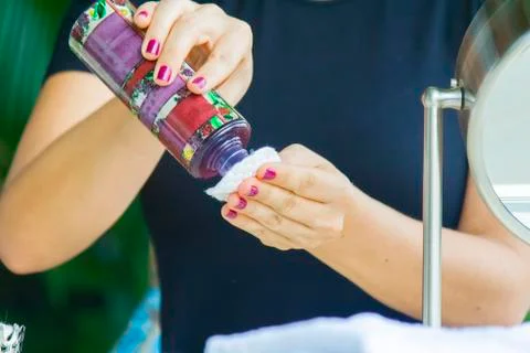 Hand applying cream Stock Photos