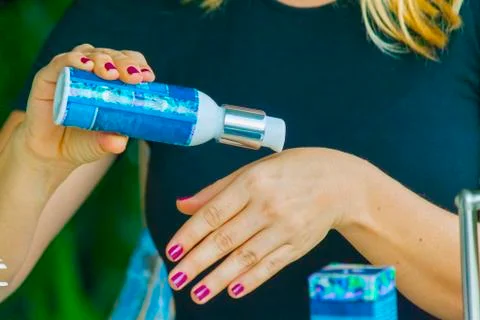 Hand applying cream Stock Photos