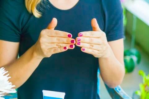 Hand applying cream Stock Photos