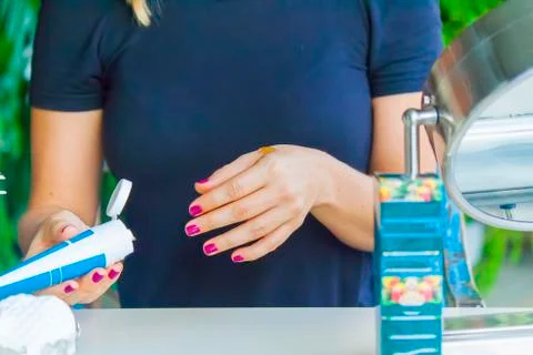 Hand applying cream Stock Photos
