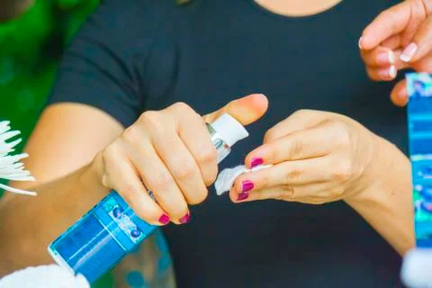Hand applying cream Stock Photos