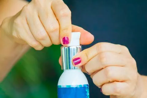Hand applying cream Stock Photos