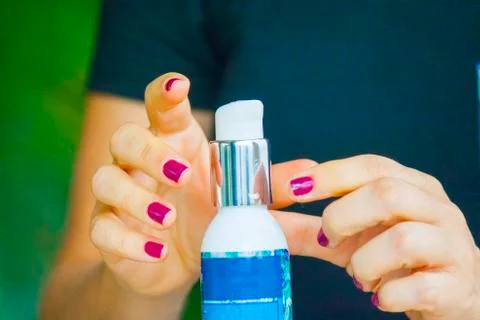 Hand applying cream Foto stock