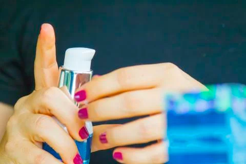 Hand applying cream Stock Photos