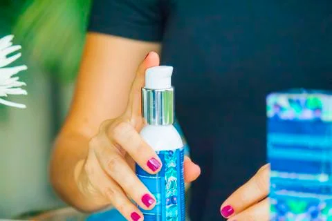 Hand applying cream Stock Photos