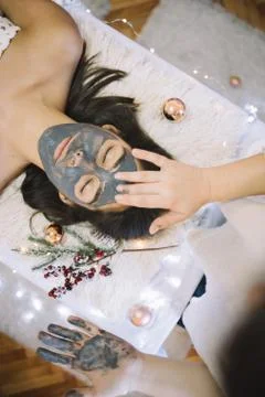 Hand applying a mask to the face Foto stock