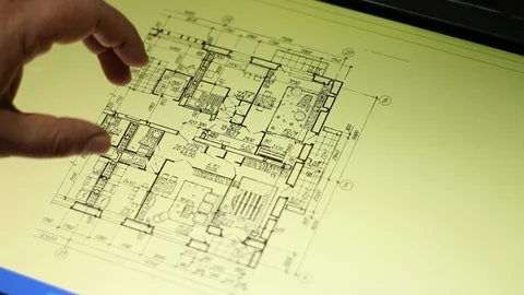 The hand of architect examines the floor plan Stock Footage 100599384