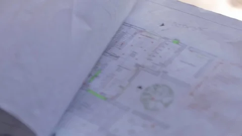 Hand of architect man looking at house building blueprint. Businessman at Stock Footage 110771441