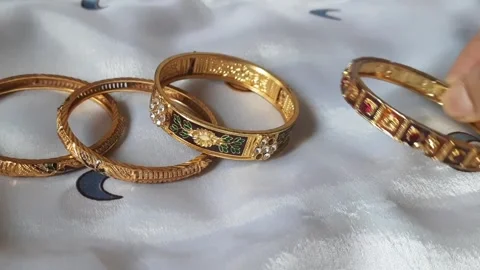 Hand Arranging Designer Bangles on Fabric – Jewelry Display Video stock 333249281