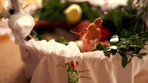 Hand arranging easter basket brought to church to be blessed on Holy Saturday Stock Footage 103821619