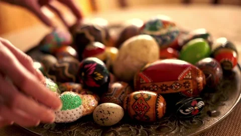 Hand arranging easter egg plate, super slow motion 動画素材 103806291