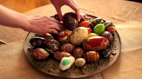 Hand arranging easter egg plate, super slow motion Stock Footage 103818592