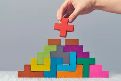 Hand arranging wood cube stacking as step stair. Business concept growth success Stock Photos