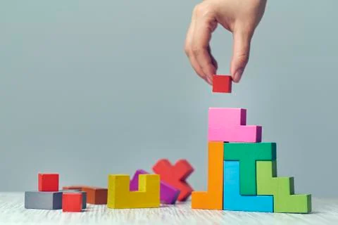 Hand arranging wood cube stacking as step stair. Business concept growth success 스톡 사진