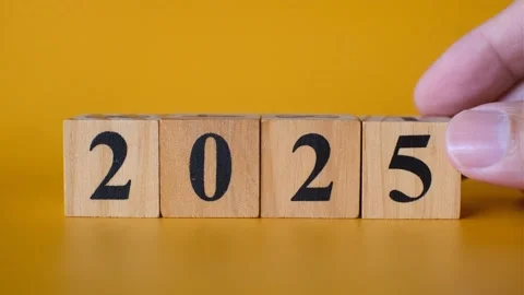 Hand Arranging Wooden Blocks to Display the Year 2025 Stock Footage 291756880