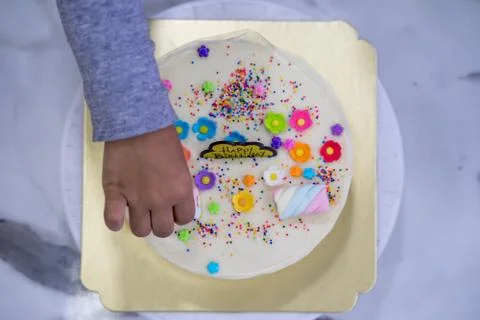 Hand of asia kid boy making a cake Stock Photos