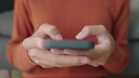 Hand of Asian girl using texting mobile phone or chat Stock Footage 165449381