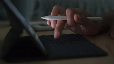 Hand of Asian women are using tablet at night. Concept work at home Stock Footage 131908478