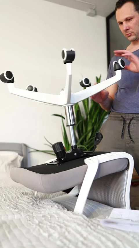 Hand assemble office chair do it yourself at home. DIY furniture assembly Stock Footage 332555249