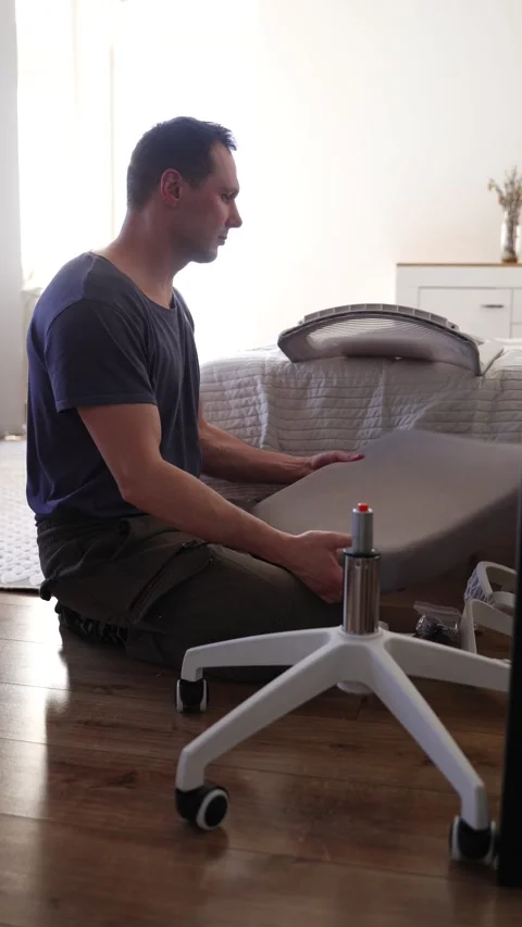 Hand assemble office chair do it yourself at home. DIY furniture assembly Stock Footage 332555310