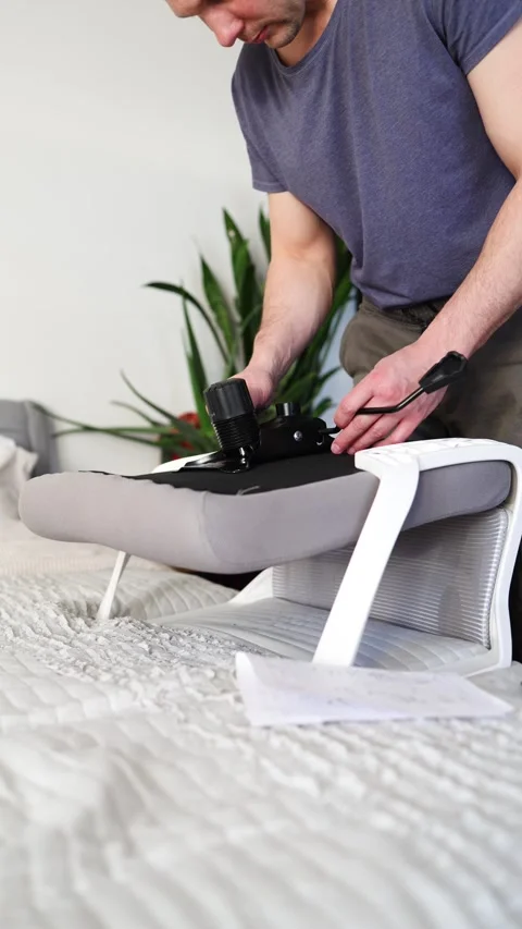 Hand assemble office chair do it yourself at home. DIY furniture assembly Stock Footage 332555737