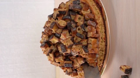 Hand assemble the table pieces of biscuit and attaches to the collapsed cake. Stock Footage 129250913