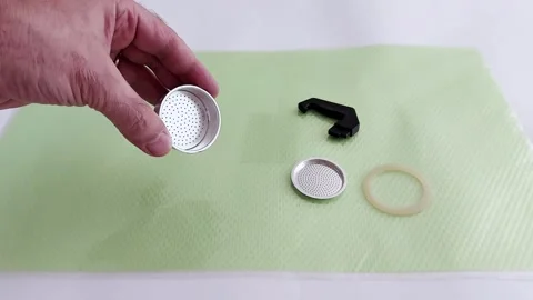 Hand Assembles Coffee Filter Parts on Soft Green Surface 스톡 동영상 314638266