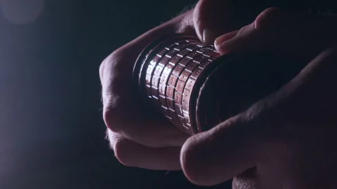 Hand attempts to break code on metal cipher lock Stock Footage 330962204