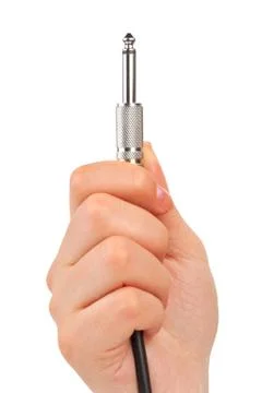 Hand with audio cable Foto stock