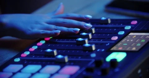 Hand on audio mixing console in blue light Stock Footage 315516171