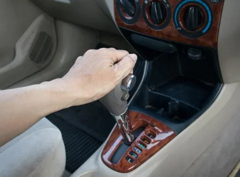 Hand on automatic gear shift Stock Photos