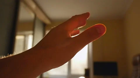 The hand on the background of the sun shows a gesture OK. The interior of the Stock Footage 91618514