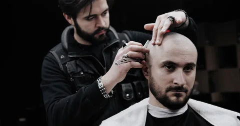 Hand of barber keeping straight razor and cutting trendy stripes on head  Stock Footage 150273571
