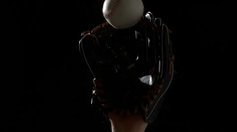 Hand in baseball mitt catching glove Stock Footage