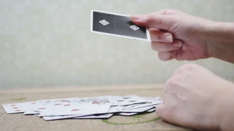 Hand beautifully flips the playing card Stock Footage 221195569