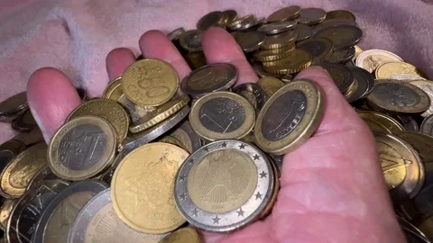 Hand on the bed among the coins Stock Footage 224882287