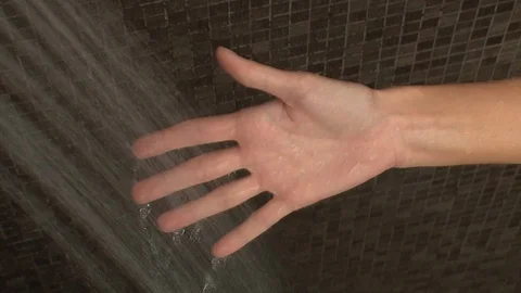 Hand being put under stream of water Video stock 95611282