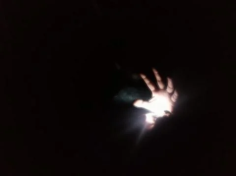 Hand Between Light and Darkness 写真素材