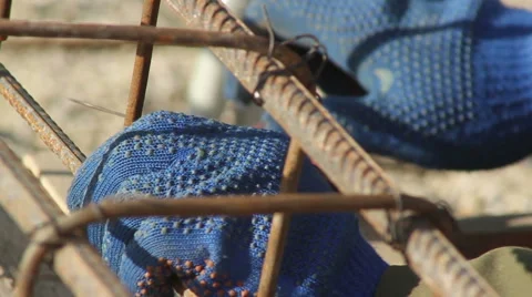 Hand binds the reinforcing cage Stock Footage 60221435