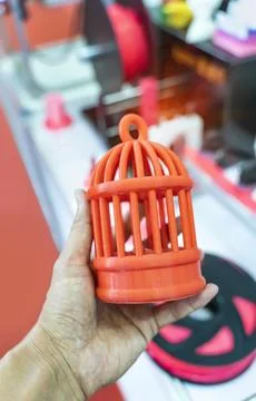 Hand with birdcage printed on 3d printer close-up Stock Photos