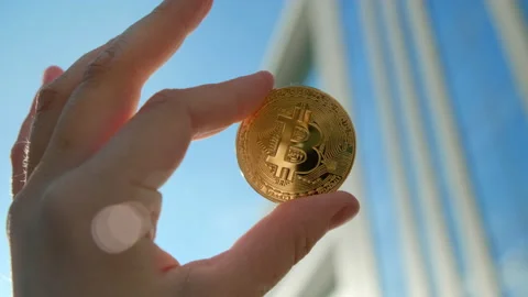 Hand with bitcoin crypto coin closeup. Stock Footage 156635548