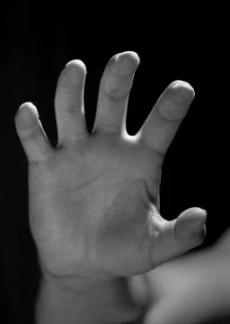 Hand on a black background Stock Photos