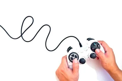 Hand on black game controller isolated on white background Stock Photos