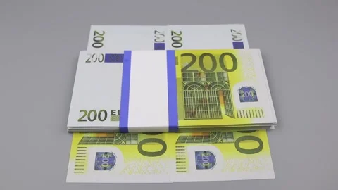 Hand in a black glove picks up a bundle of 200 euro banknotes lying on the table 스톡 동영상 142588684