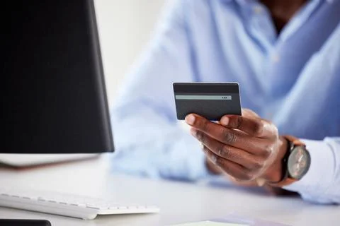 Hand, black man and computer with credit card, office and online shopping for Foto stock