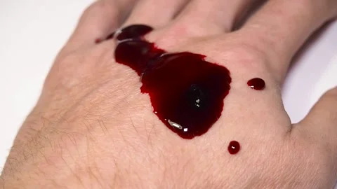 Hand with blood on white background. Stock Footage 99823188