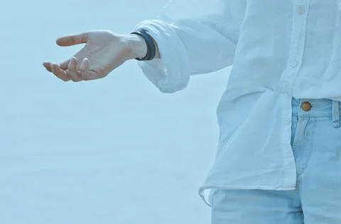 Hand on a blue background Stock Photos